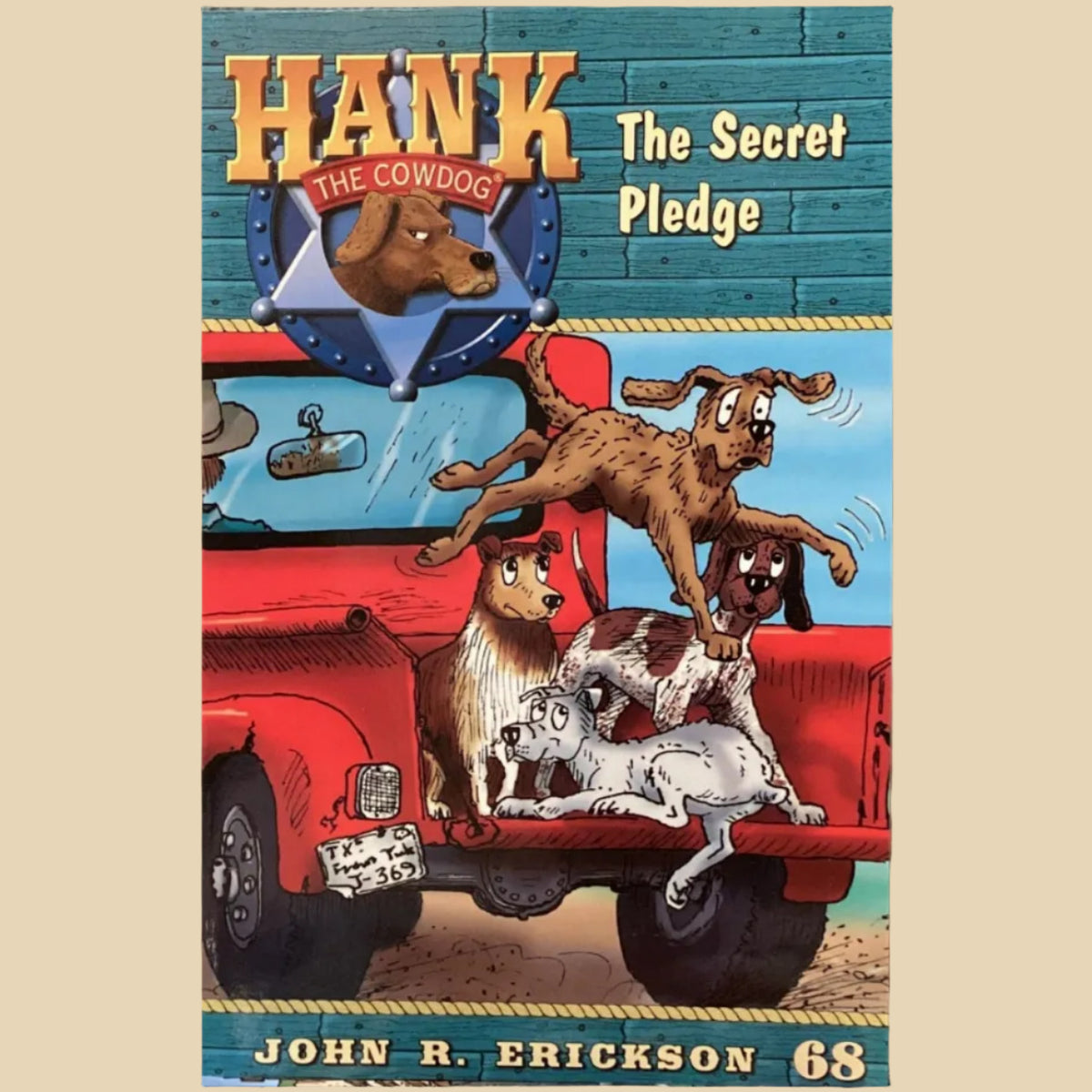 Book titled 'Hank the Cowdog: The Secret Pledge' by John R. Erickson on a shelf.