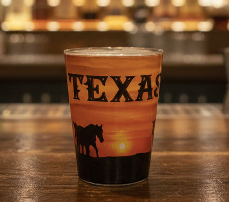 Tumbler with 'Texas' design on a marble counter in a store setting