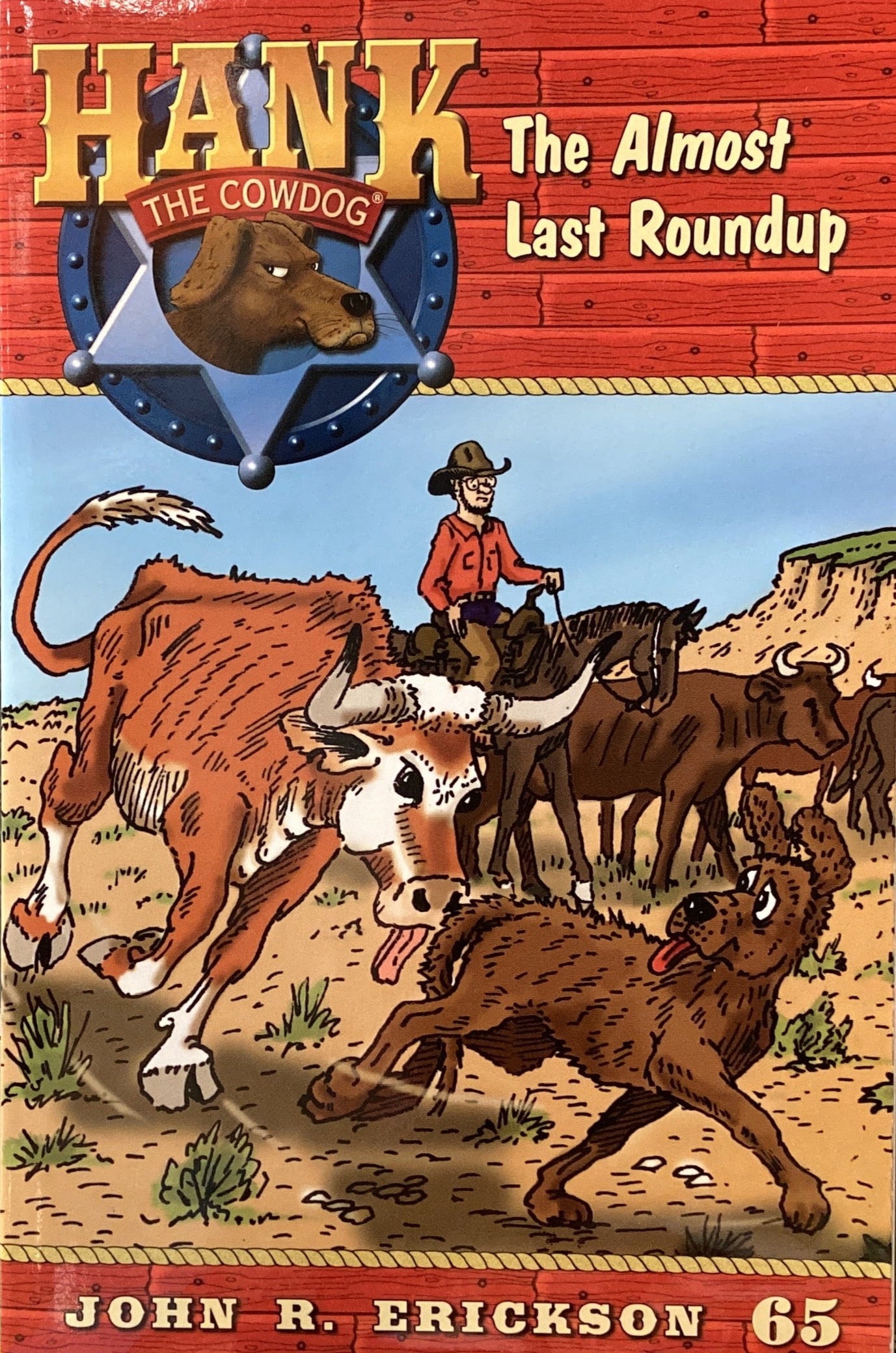 Board game box titled 'Hank the Cowboy: The Almost Last Roundup' by John R. Erickson on a gray surface.
