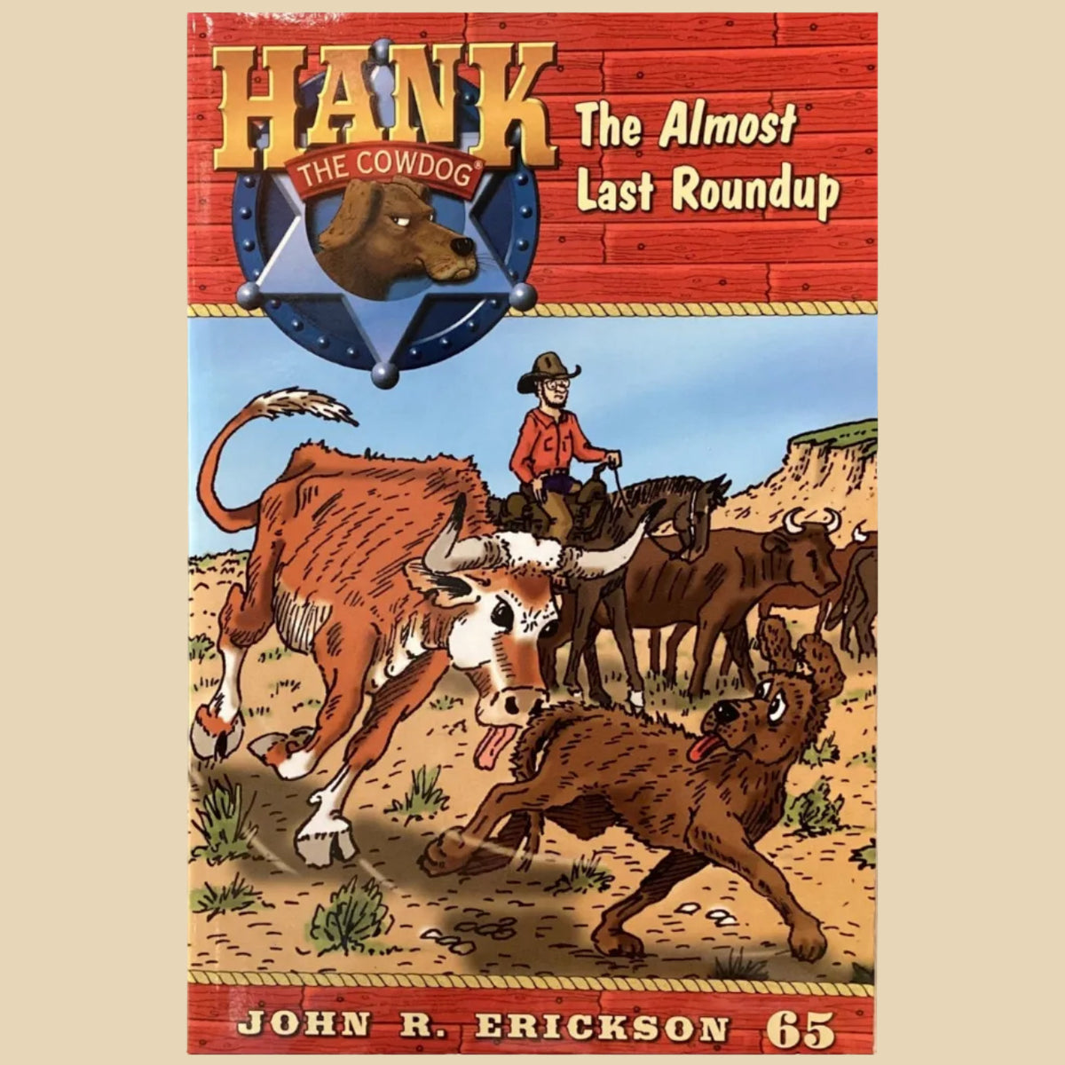 Board game box titled 'Hank the Cowboy: The Almost Last Roundup' by John R. Erickson on a gray surface.