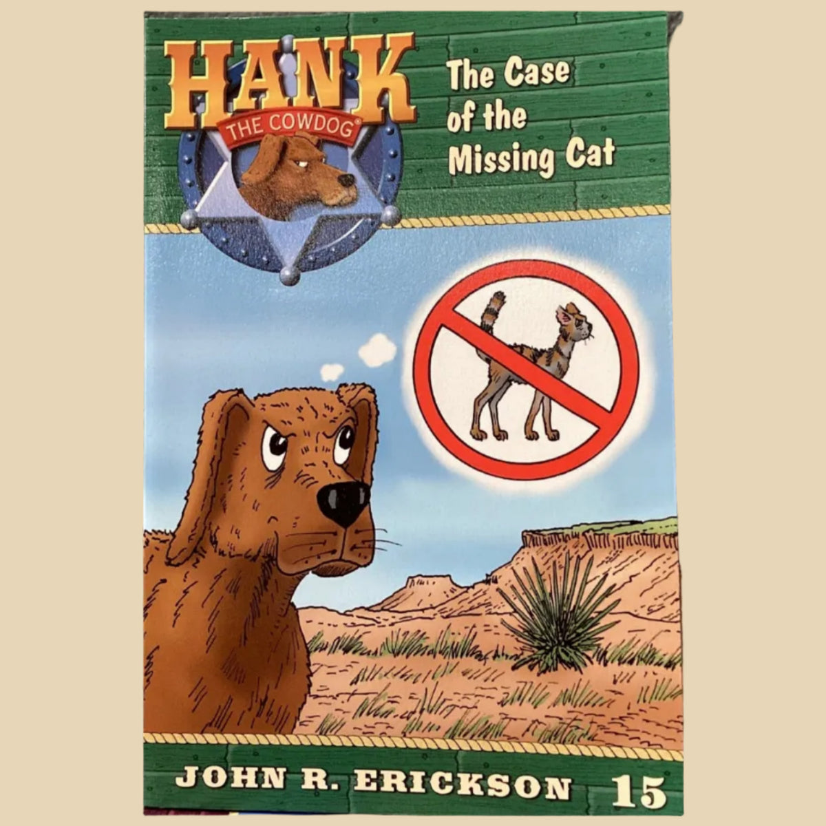Book titled 'Hank the Cowdog: The Case of the Missing Cat' by John R. Erickson on a shelf.