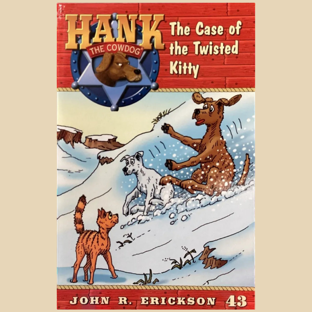 Book titled 'Hank the Cowdog: The Case of the Twisted Kitty' by John R. Erickson on a dark surface.