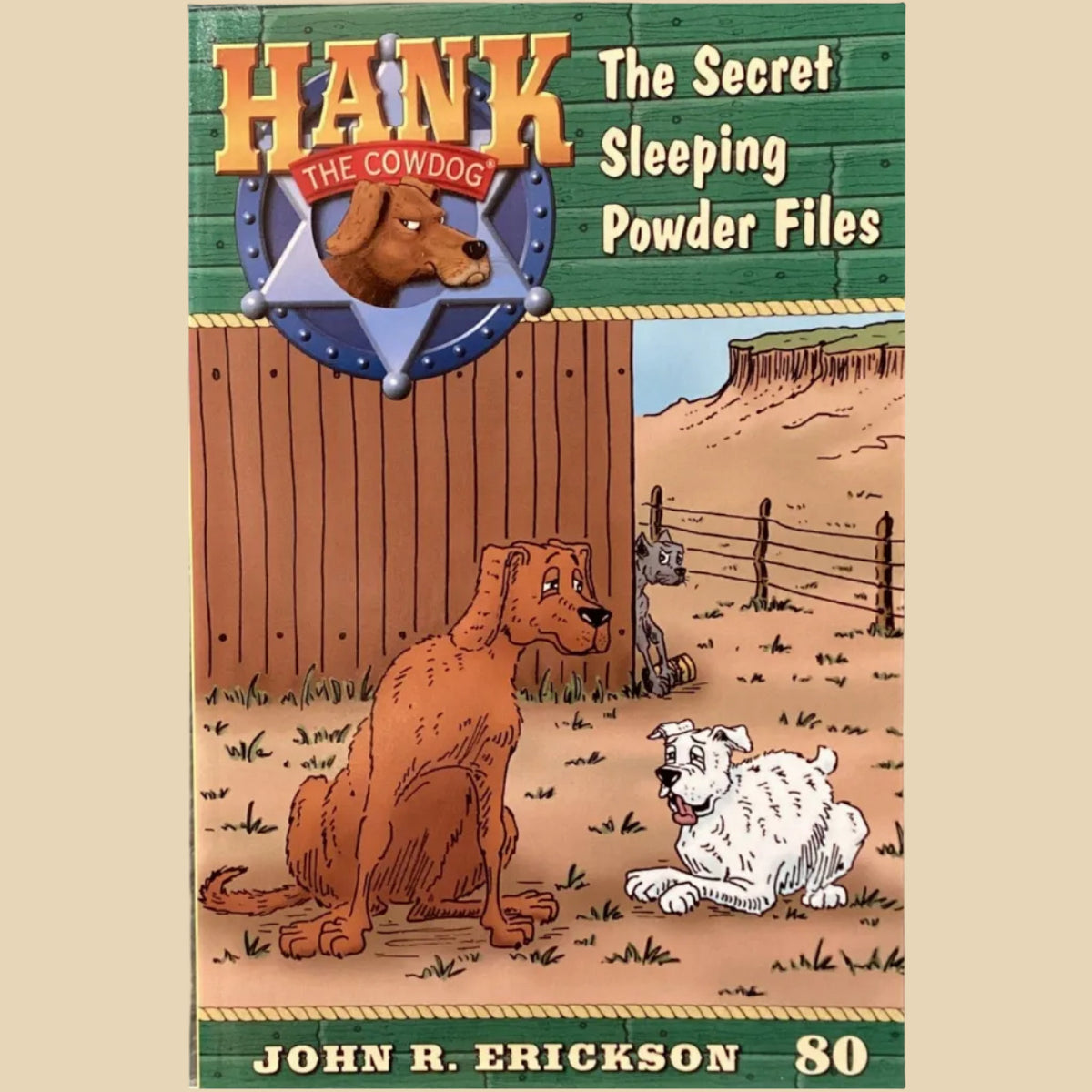 Book cover of 'Hank the Cowdog: The Secret Sleeping Powder Files' by John R. Erickson on a gray surface.