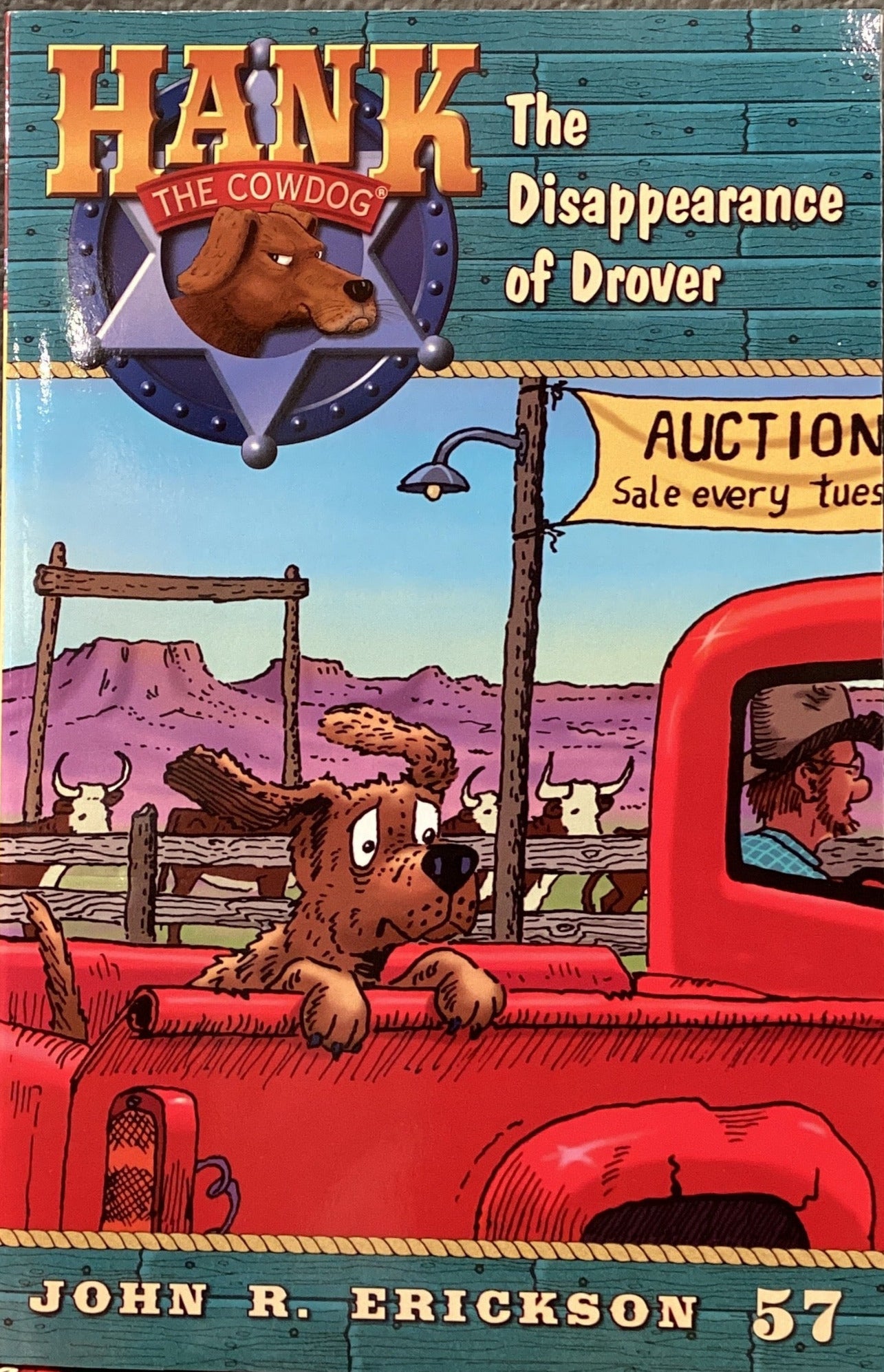 Book titled 'Hank the Cowdog: The Disappearance of Drover' by John R. Erickson on a surface.