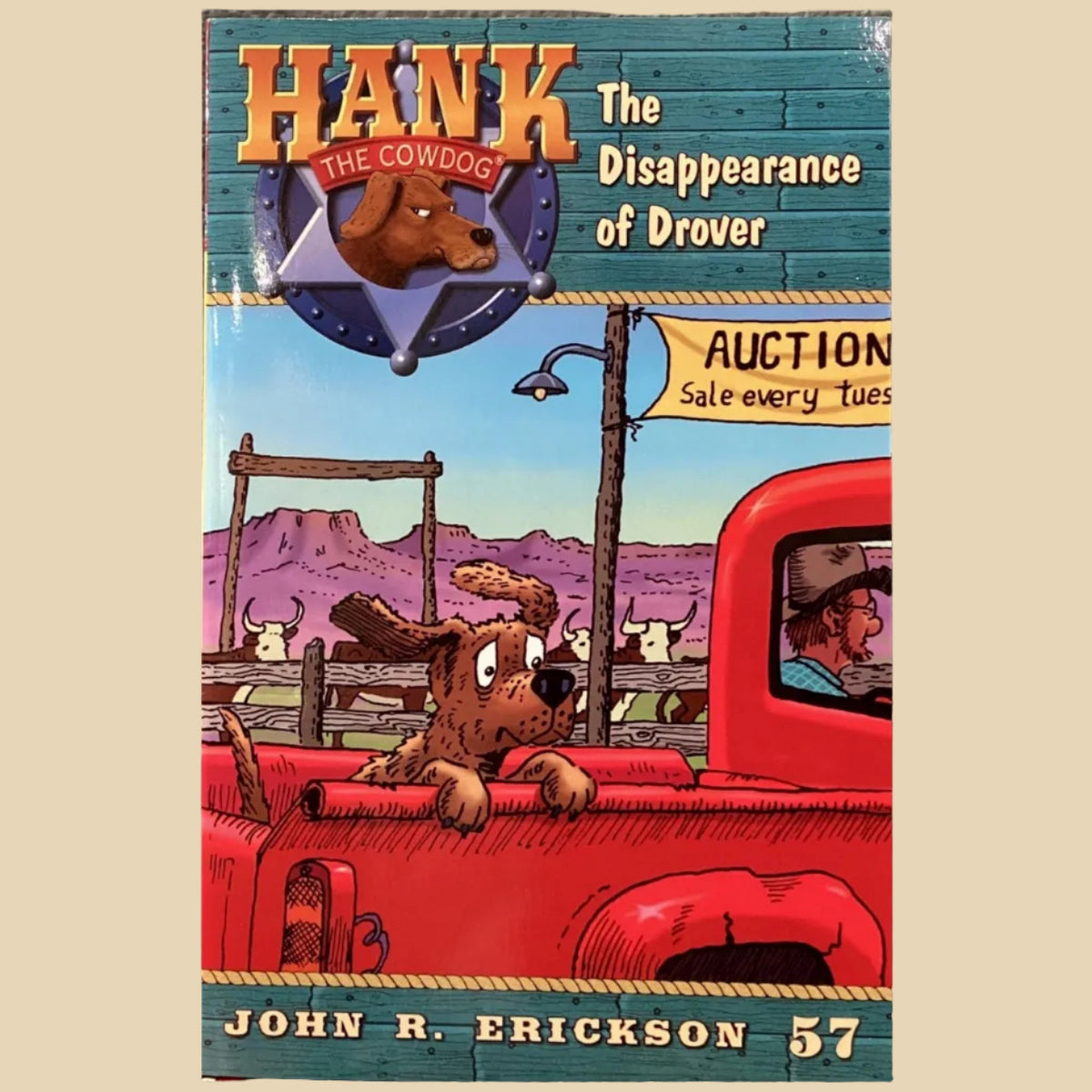 Book titled 'Hank the Cowdog: The Disappearance of Drover' by John R. Erickson on a surface.