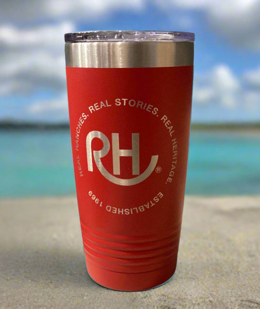 Red tumbler with a logo on a gray surface