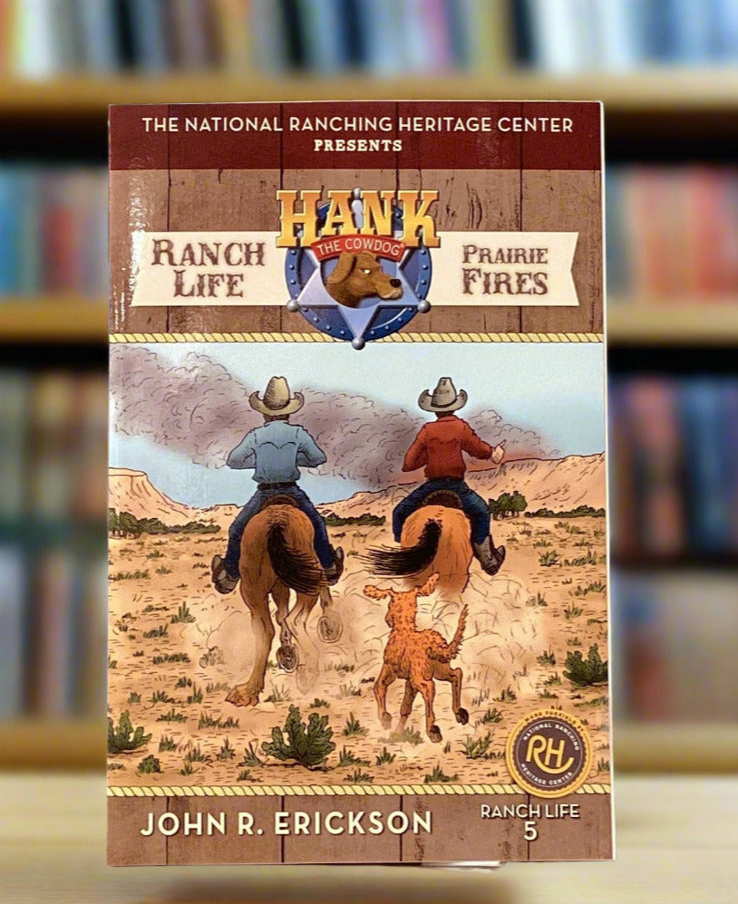 Book titled 'Ranch Life & Prairie Fires' by John R. Erickson on a gray surface.