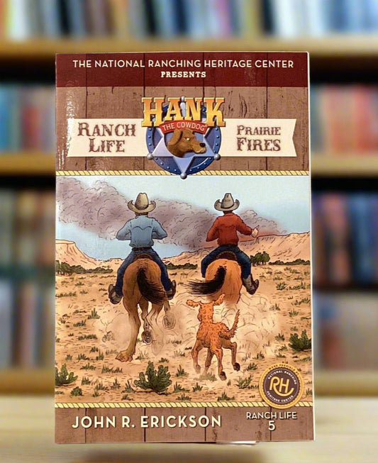Book titled 'Ranch Life & Prairie Fires' by John R. Erickson on a gray surface.