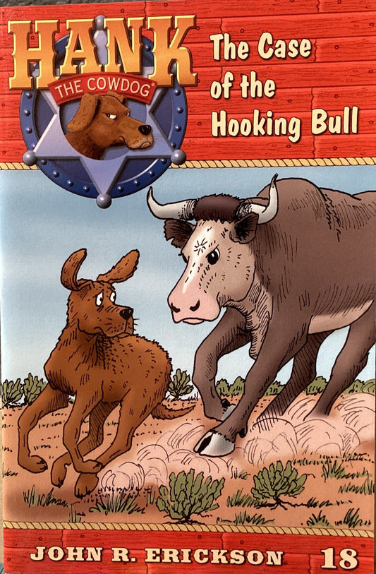 Book cover of 'Hank the Cowdog: The Case of the Hooking Bull' by John R. Erickson on a gray surface.