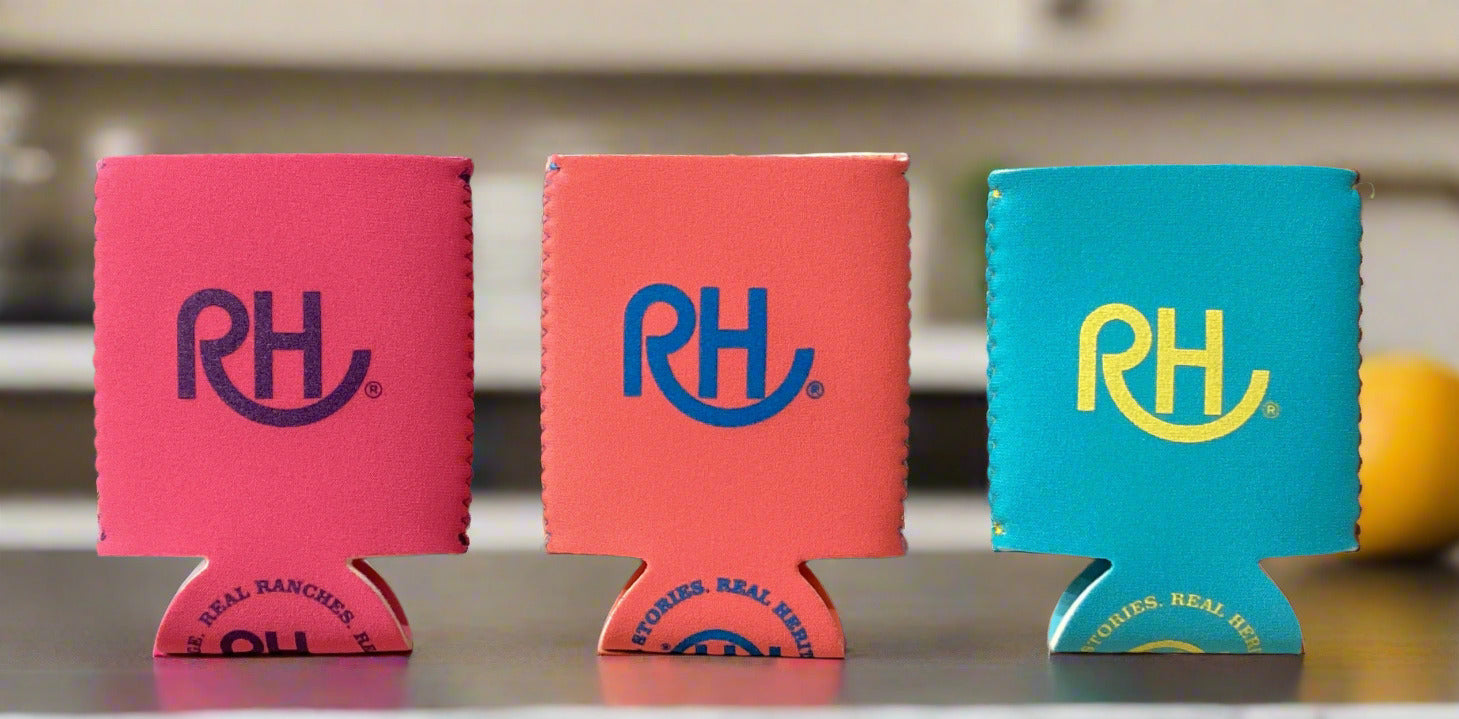 Three can coolers with 'RH' logo on a gray surface