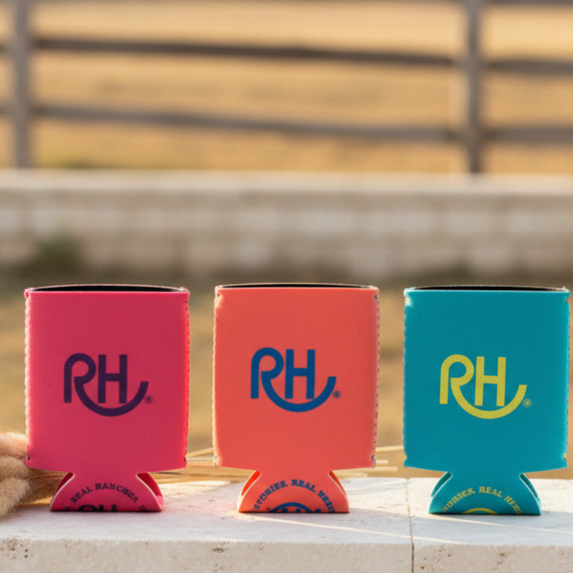 Three can coolers with 'RH' logo on a gray surface