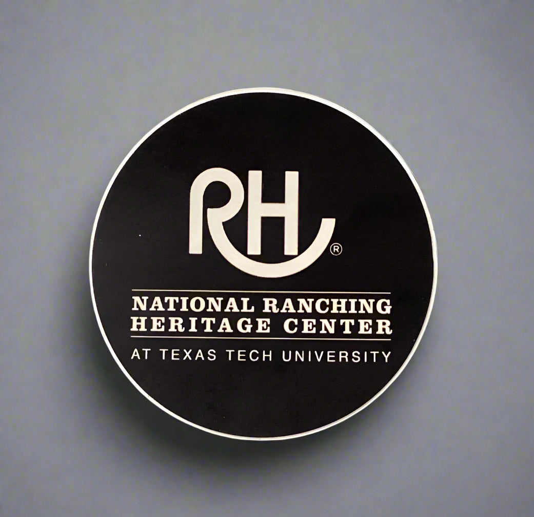 Round black sticker with 'RH' logo and text on a textured gray surface.