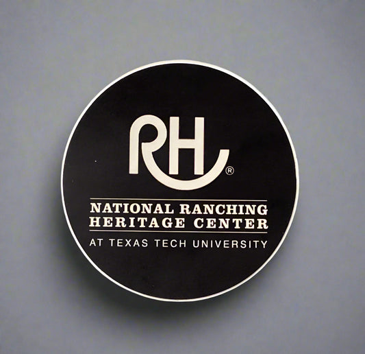 Round black sticker with 'RH' logo and text on a textured gray surface.