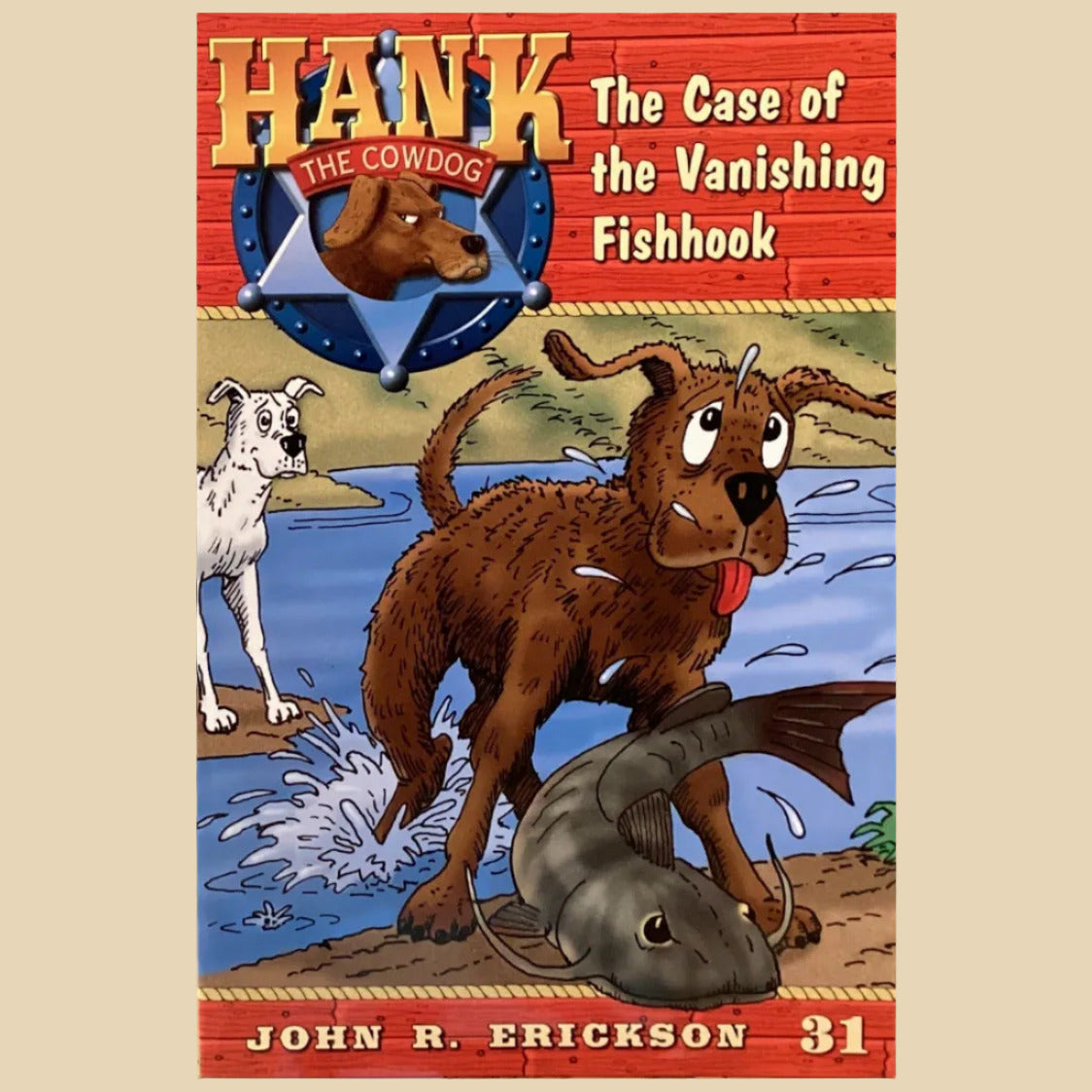 Book titled 'Hank the Cowdog: The Case of the Vanishing Fishhook' by John R. Erickson on a gray surface.