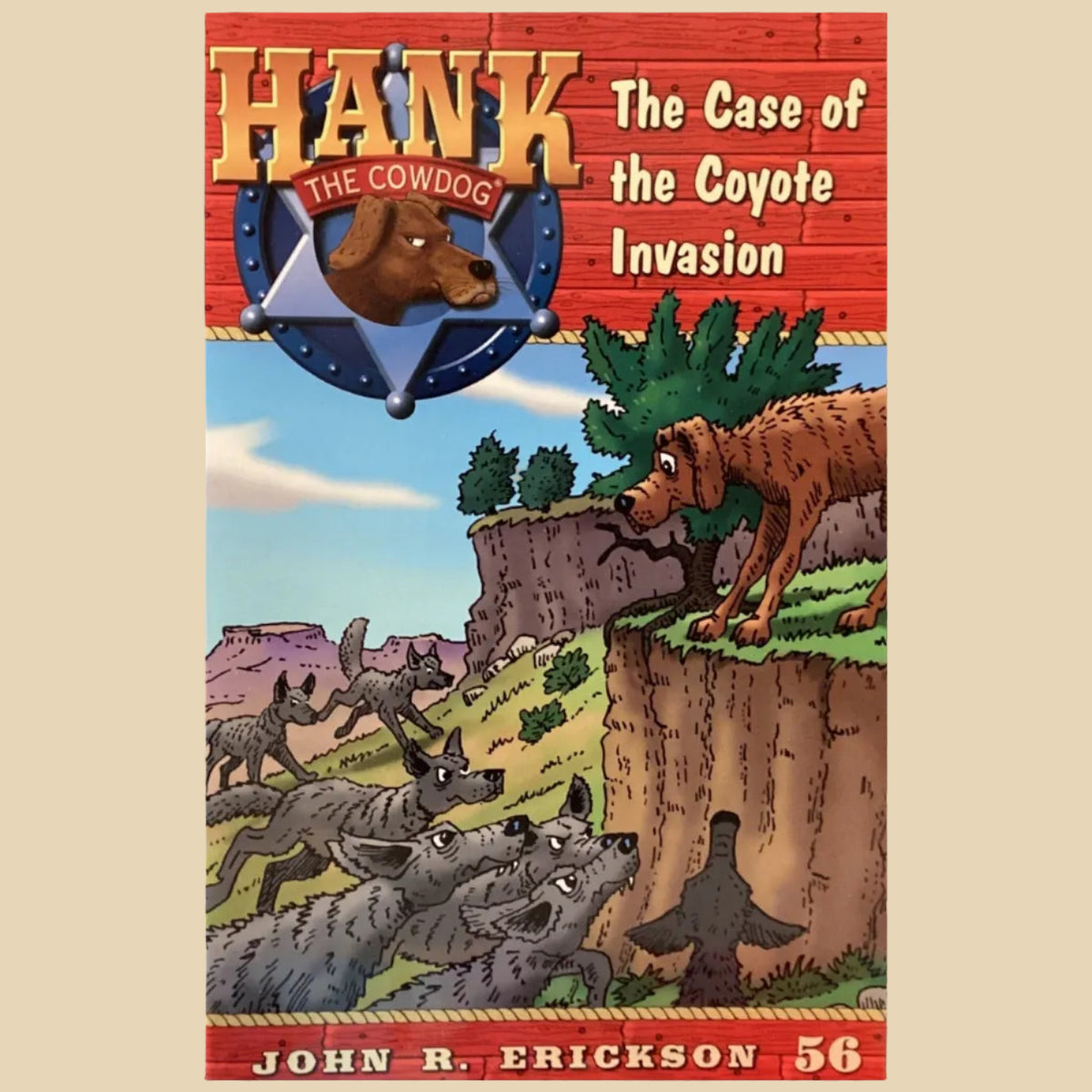 Book titled 'Hank the Cowdog: The Case of the Coyote Invasion' by John R. Erickson on a surface.