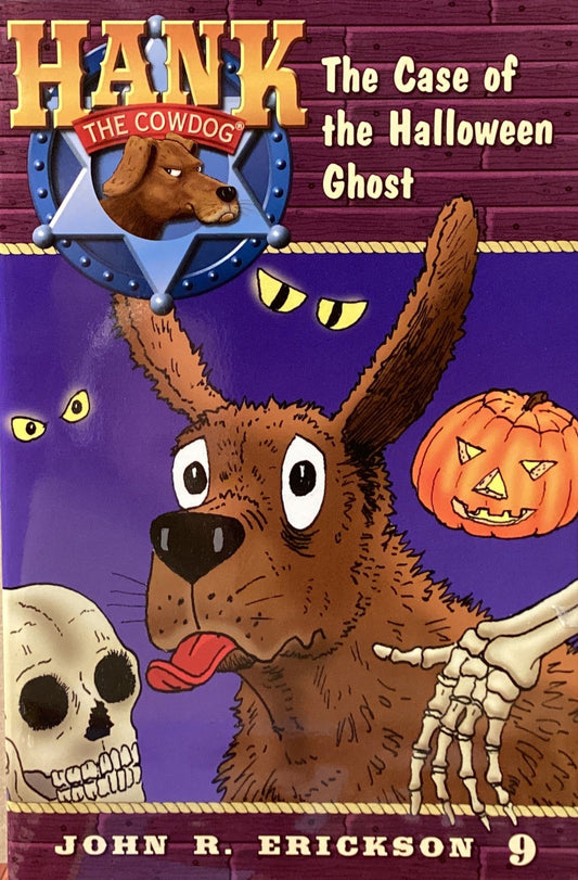 Book titled 'Hank the Cowdog: The Case of the Halloween Ghost' by John R. Erickson on a surface with a gray wall background.