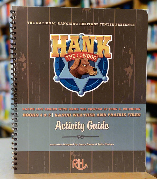 Notebook titled 'Hank the Cowdog Activity Guide' on a gray surface