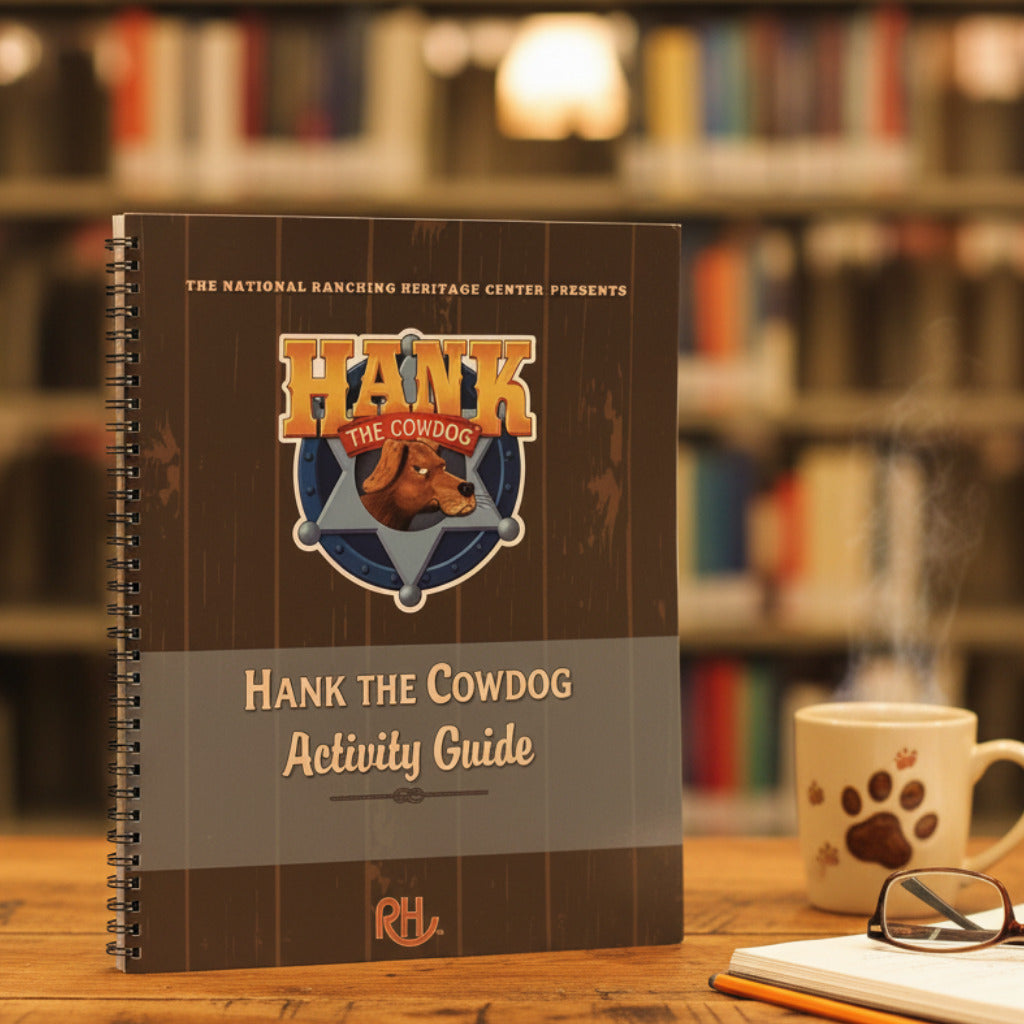 Notebook titled 'Hank the Cowdog Activity Guide' on a gray surface