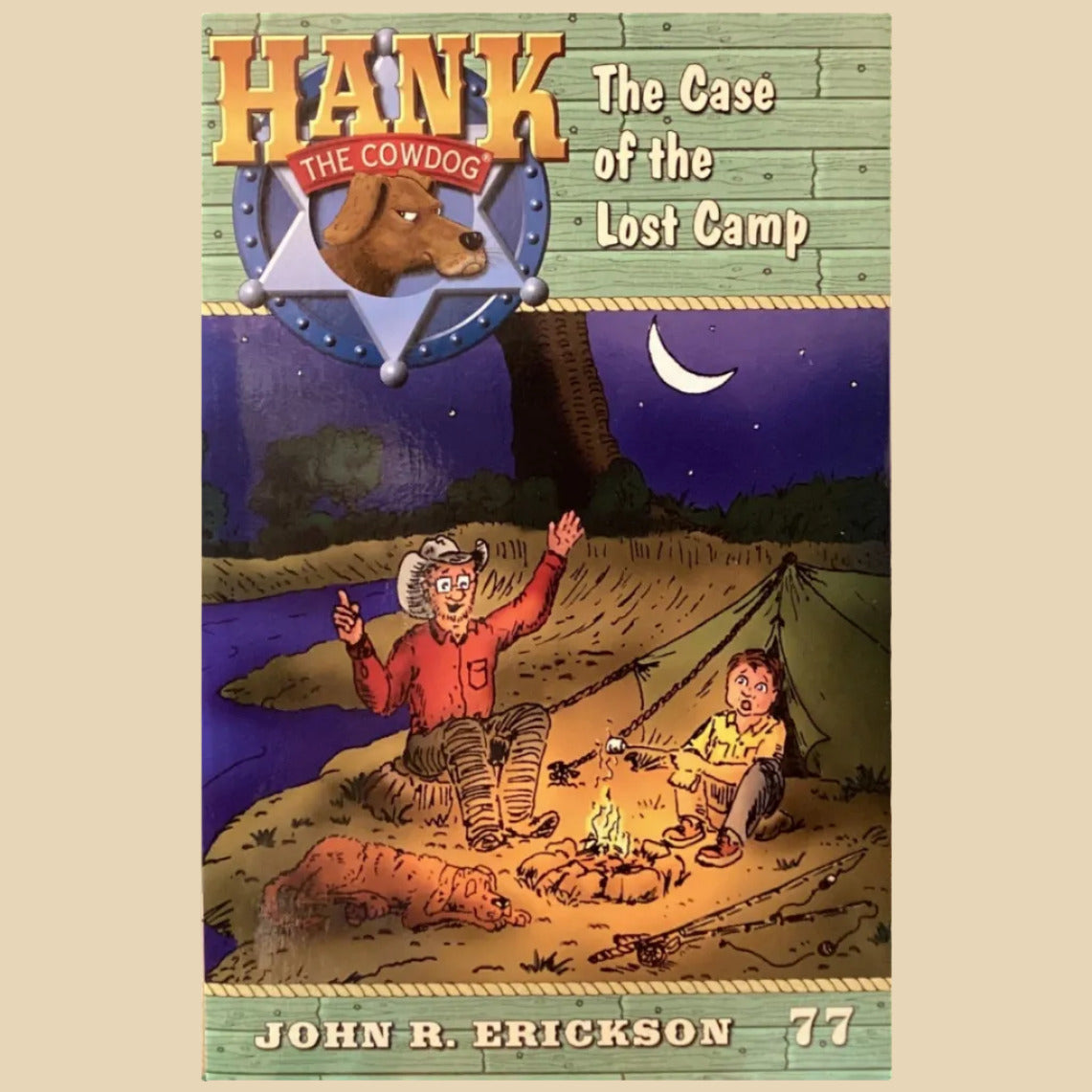 Book titled 'Hank the Cowdog: The Case of the Lost Camp' by John R. Erickson on a shelf.