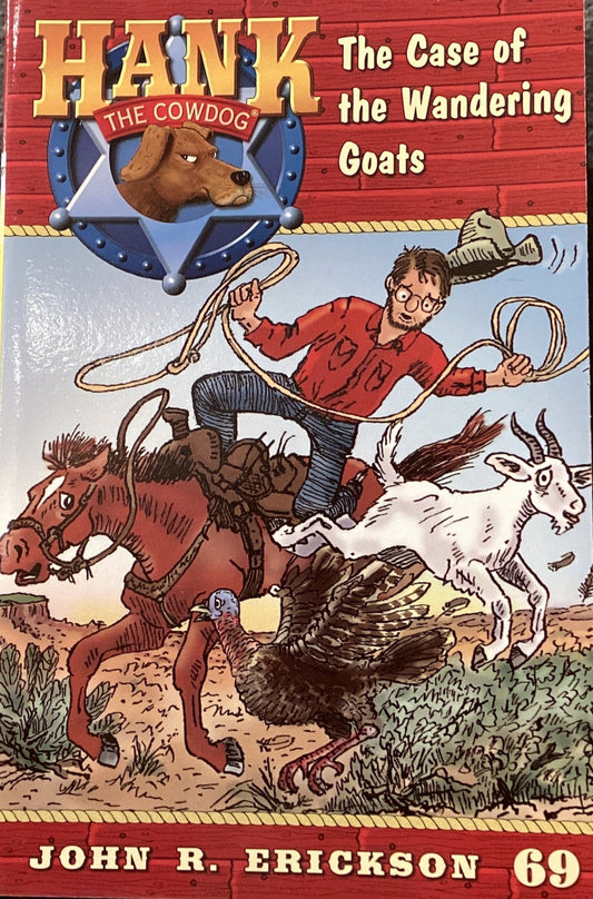 Book titled 'Hank the Cowdog: The Case of the Wandering Goats' by John R. Erickson on a dark surface.