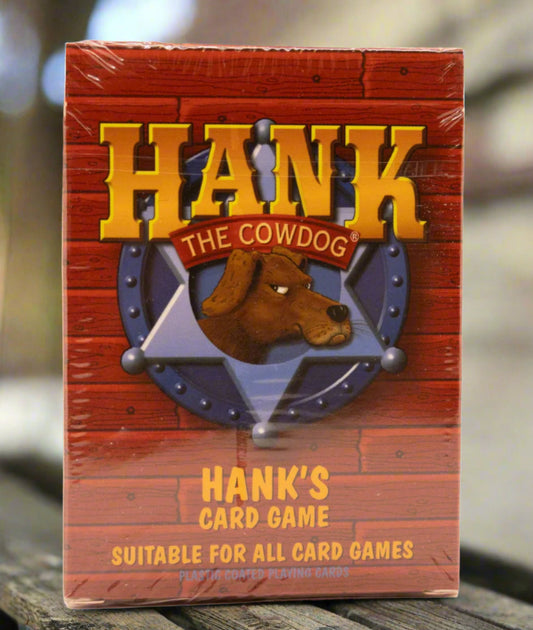 Packaging for 'HANK THE COWDOG' card game featuring a brown bear character illustration.