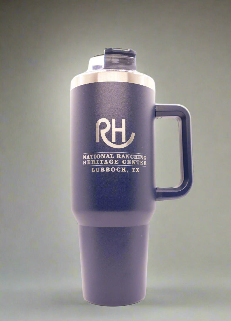 A navy blue ceramic mug with a straw, featuring a hippo design on the front and personalized text.