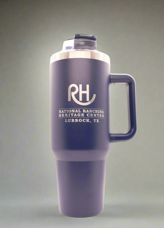 A navy blue ceramic mug with a straw, featuring a hippo design on the front and personalized text.