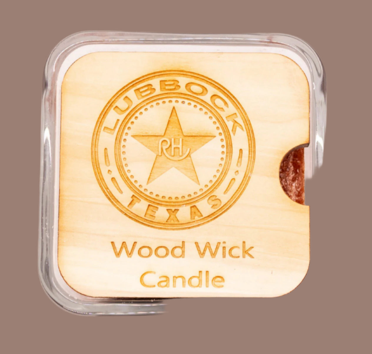 Wooden candle with Lubbock, Texas design and 'Wood Wick Candle' text on a brown background