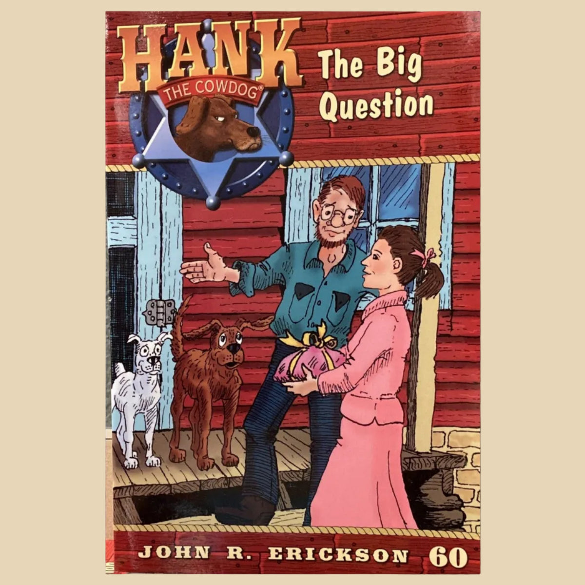 Book titled 'Hank the Cowdog: The Big Question' by John R. Erickson on a surface.