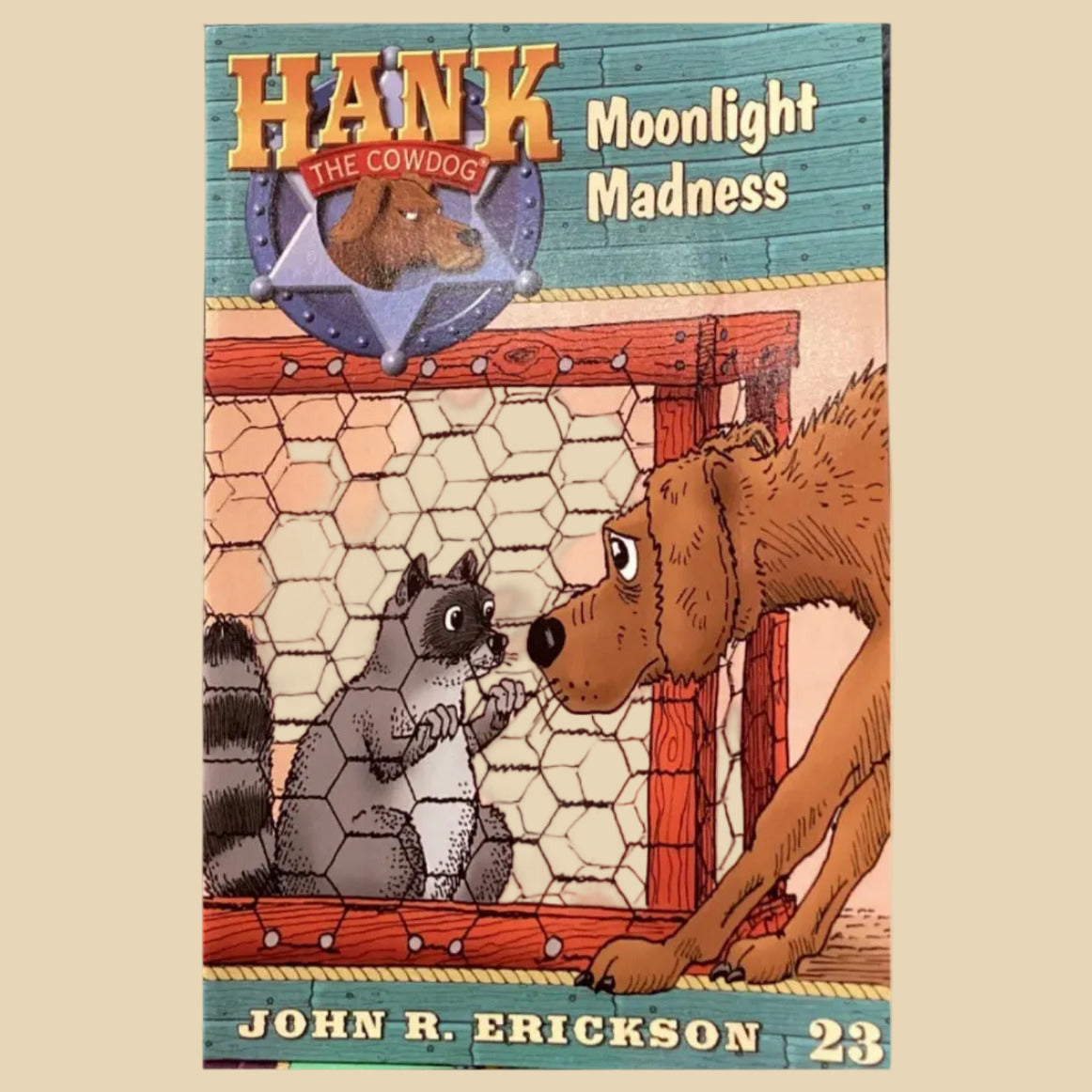Children's book titled 'Moonlight Madness' by John R. Erickson on a dark surface.