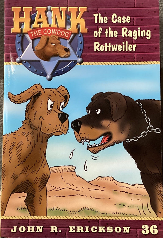 Book titled 'Hank the Cowdog: The Case of the Raging Rottweiler' by John R. Erickson on a surface with a gray wall background.