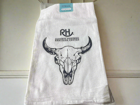 White towel with bull skull design and 'RH' logo on a beige surface