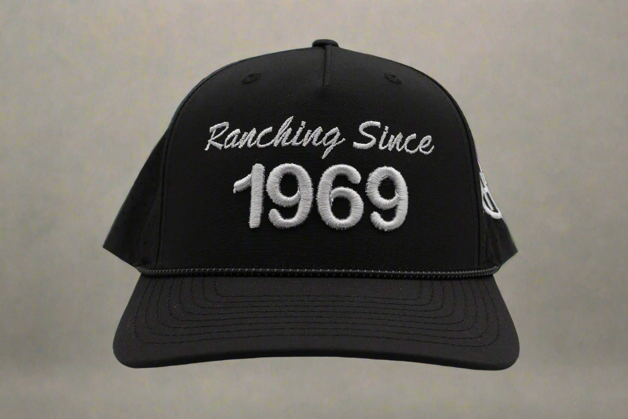 Black cap with 'Ranching Since 1969' text on a white background