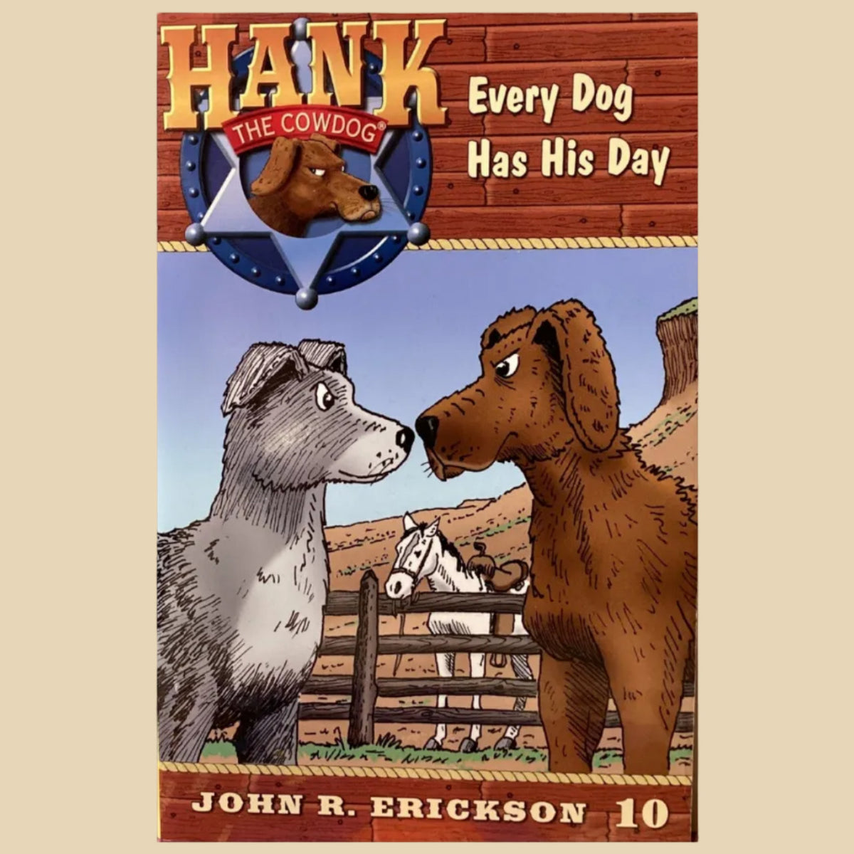 Book titled 'Hank the Cowdog: Every Dog Has His Day' by John R. Erickson on a textured wall background