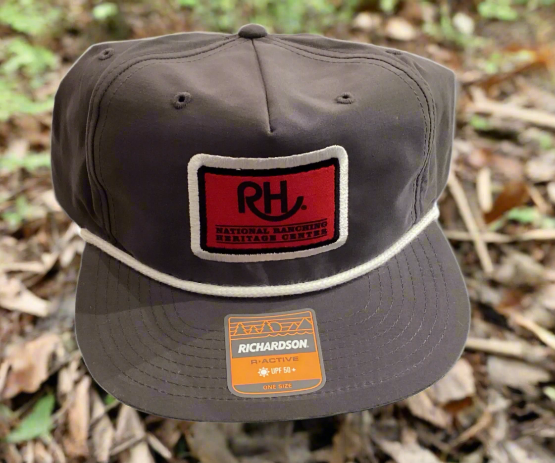 A gray snapback cap with a red and white 'RH' logo patch on the front.