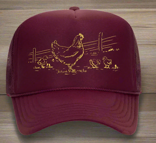 Maroon cap with gold chicken design on a white background