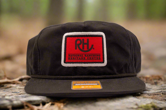 A black snapback cap with a red and white 'RH' logo on the front.