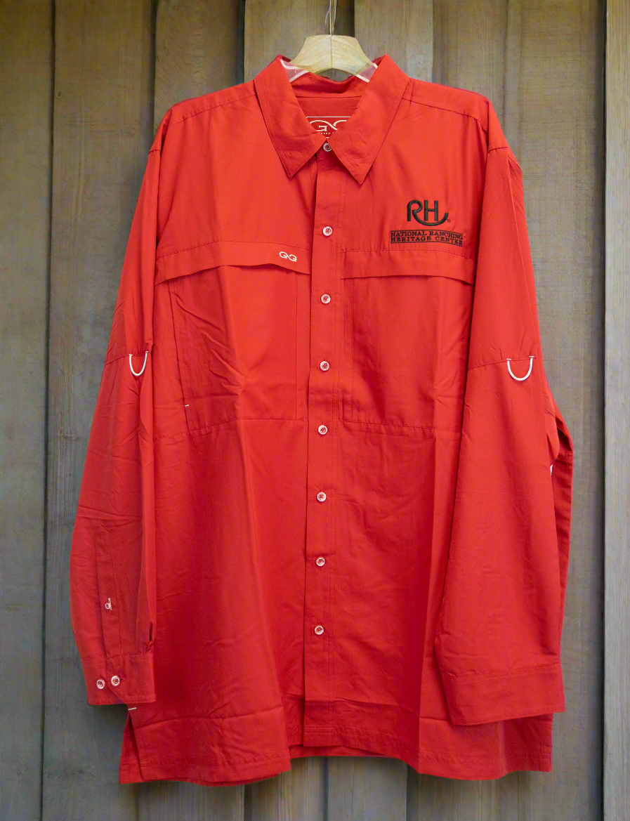 A long sleeve button-up red shirt with pockets and a logo on the chest.