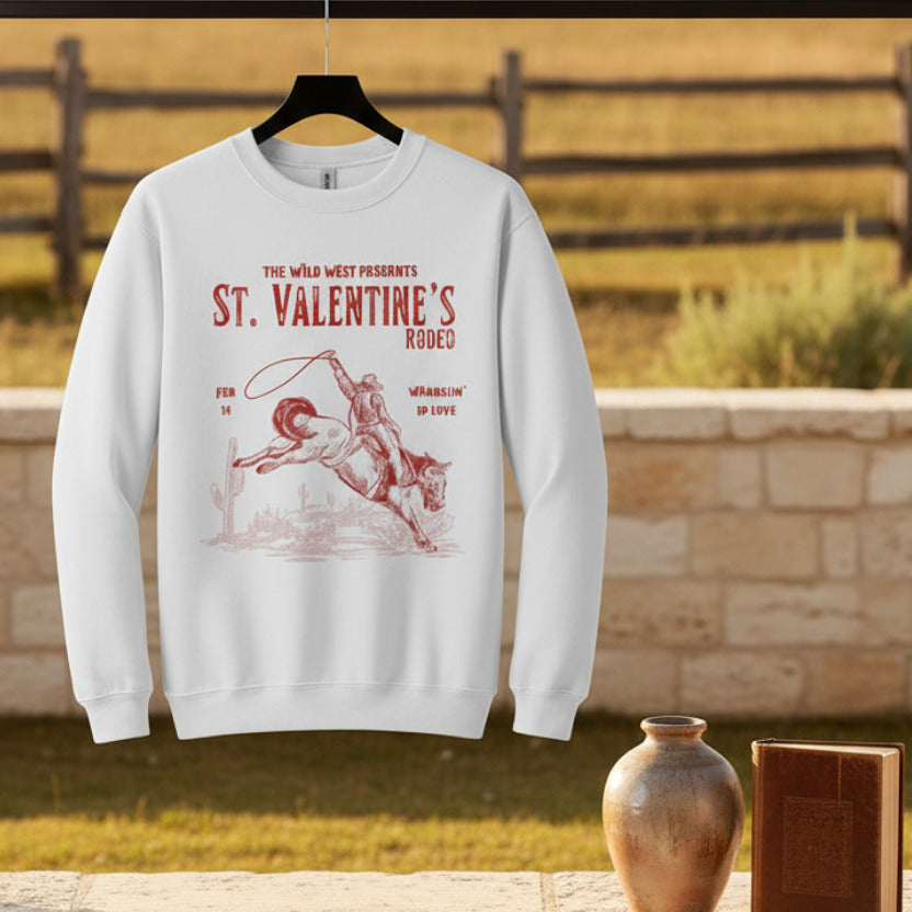 White sweatshirt with red graphic and text about St. Valentine's Rodeo on a white background