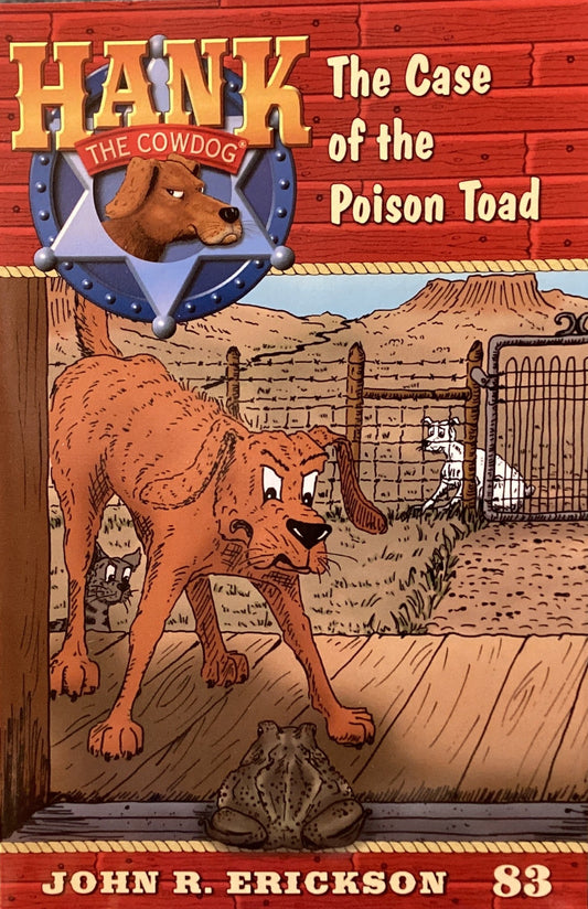Book titled 'Hank the Cowdog: The Case of the Poison Toad' by John R. Erickson on a gray surface.