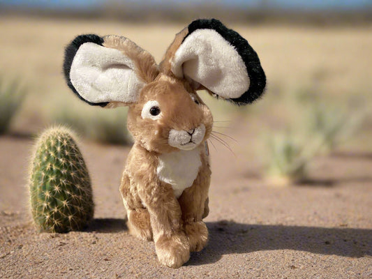 Plush rabbit toy with large ears on a neutral background