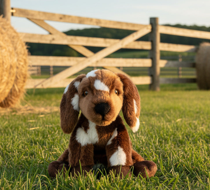 Plush dog toy with brown and white fur on a white background