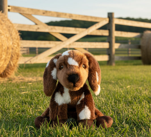 Plush dog toy with brown and white fur on a white background