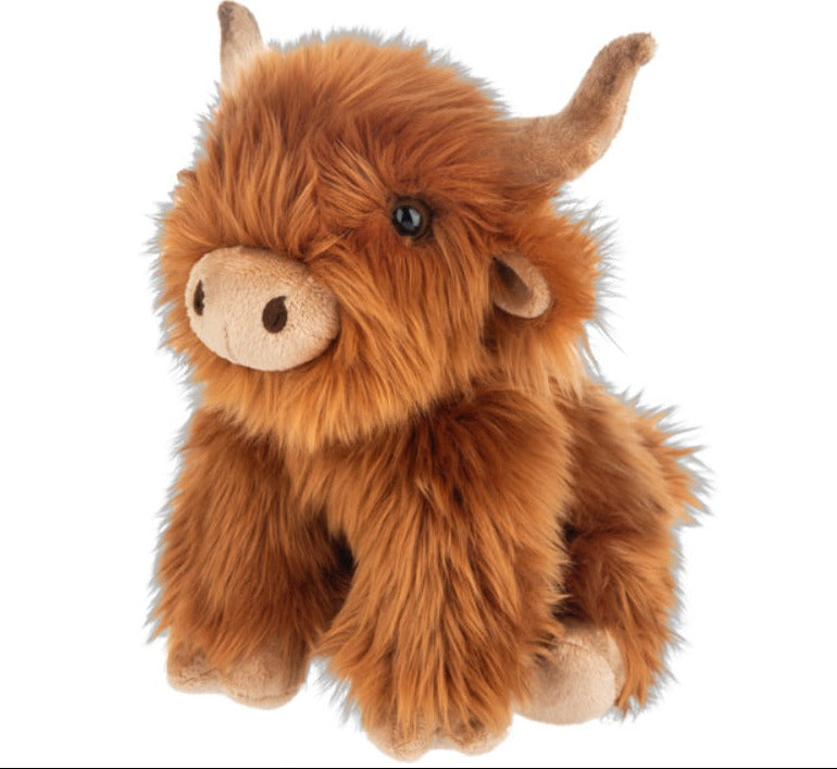 Plush toy highland cow on a white background