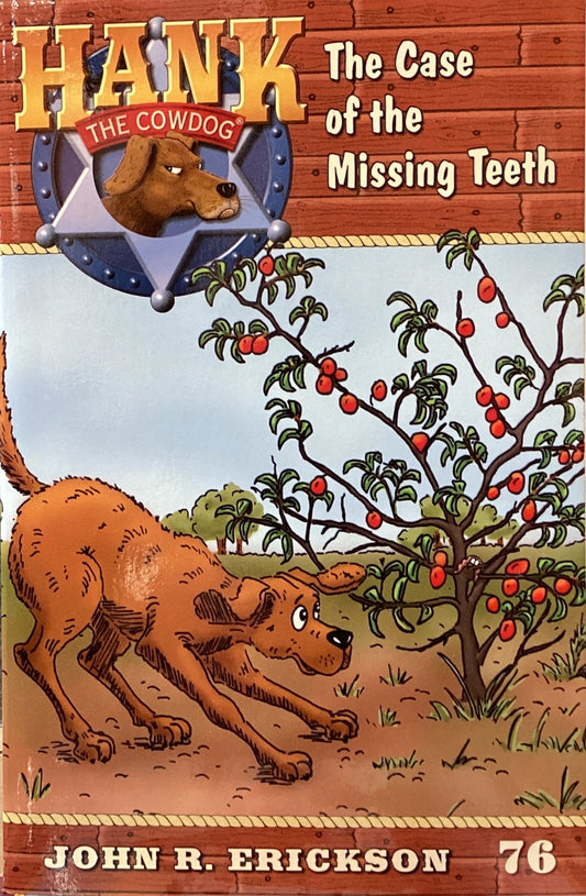 Book titled 'Hank the Cowdog: The Case of the Missing Teeth' by John R. Erickson on a gray surface.