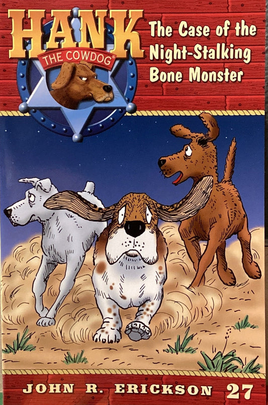 Book titled 'Hank the Cowdog: The Case of the Night-Stalking Bone Monster' by John R. Erickson on a shelf.
