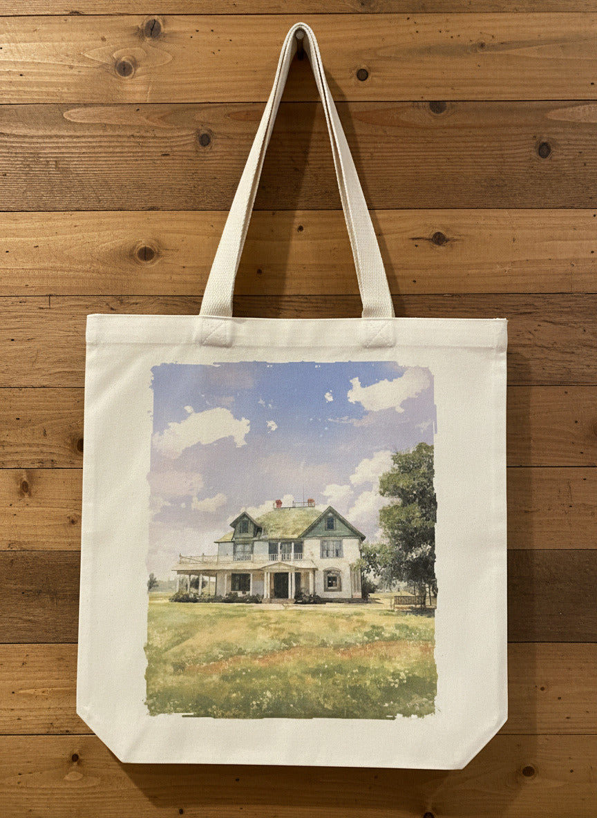 Tote bag with a printed design of a house on a wooden surface