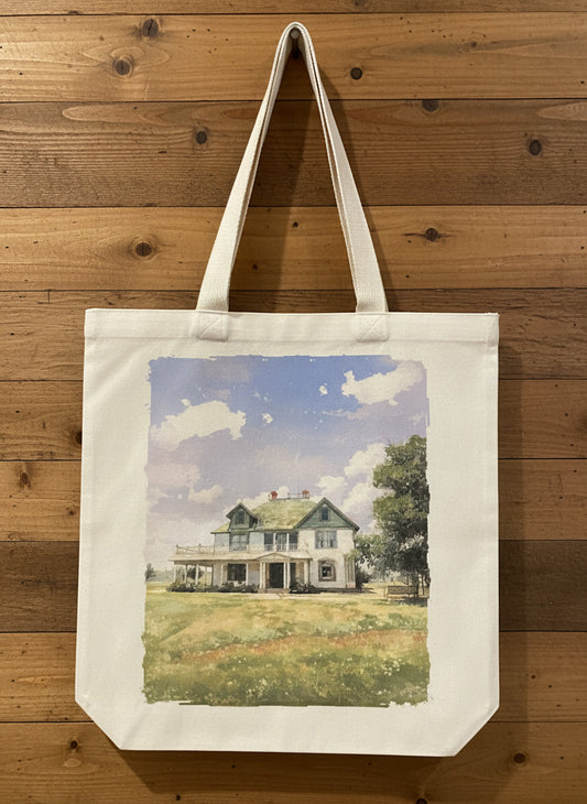 Tote bag with a printed design of a house on a wooden surface