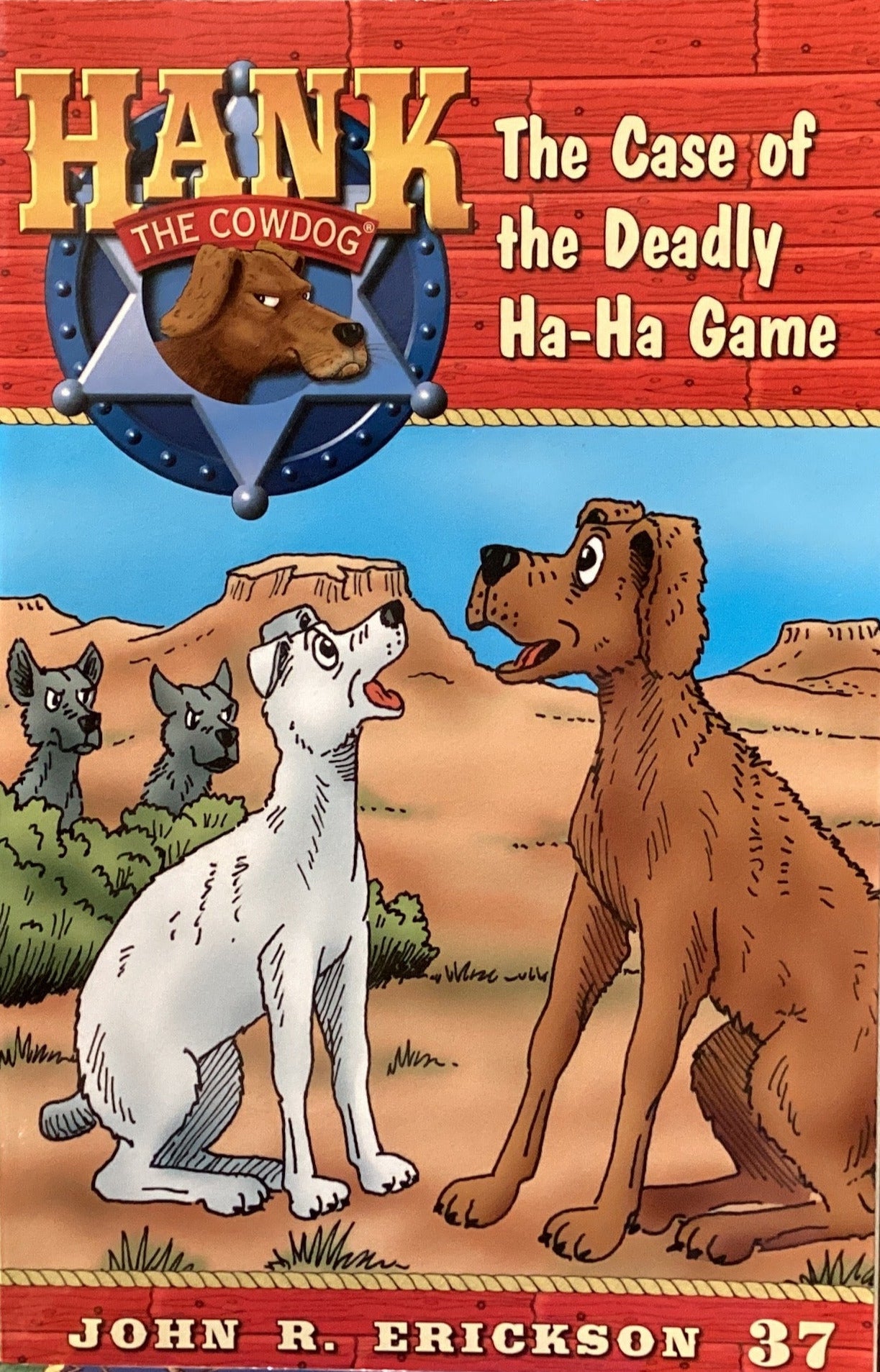 Book titled 'Hank the Cowdog: The Case of the Deadly Ha-Ha Game' by John R. Erickson on a surface with a gray wall background.