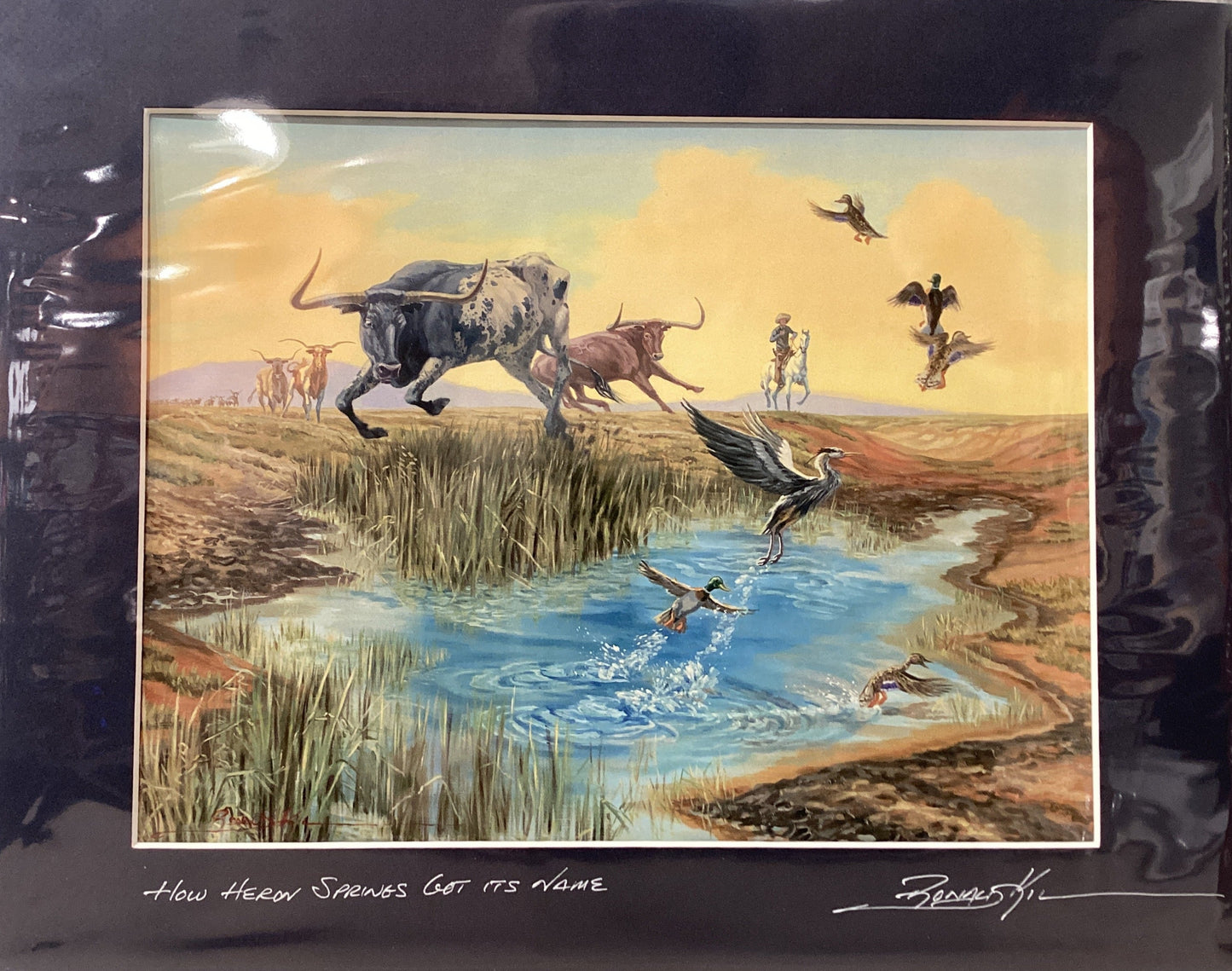 Framed artwork of a natural landscape with animals and birds, signed by the artist.